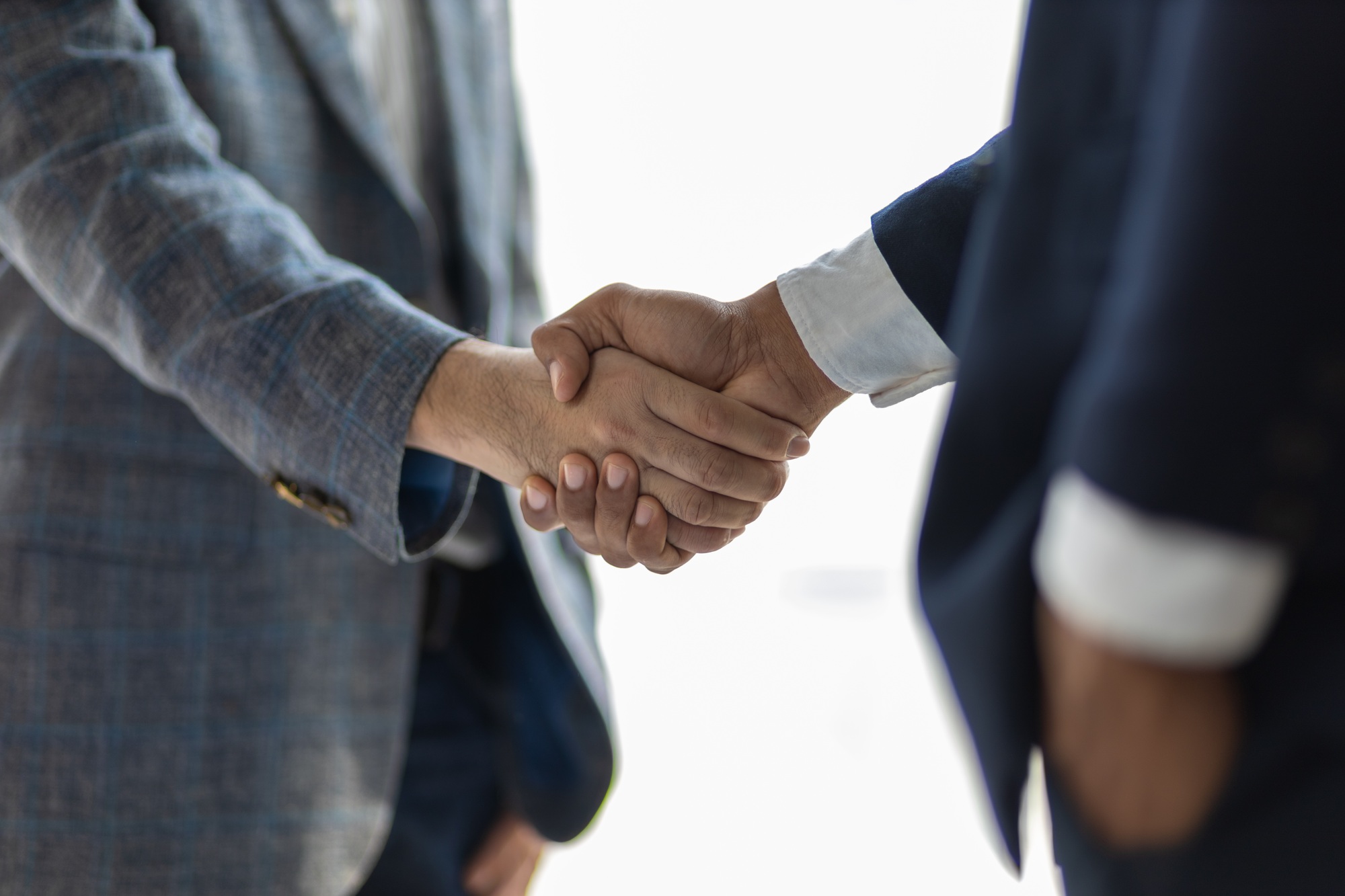 Business partners shaking hands in a meeting. Business and financial cooperation.